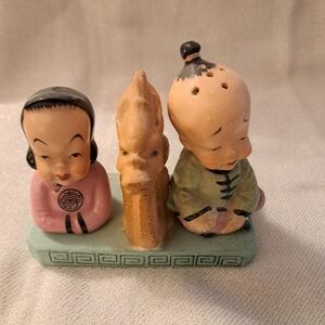 Vintage unique ceramic salt and pepper shakers.